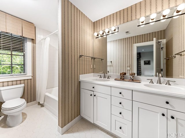 full bathroom with shower / bathtub combination with curtain, vanity, toilet, and tile patterned floors