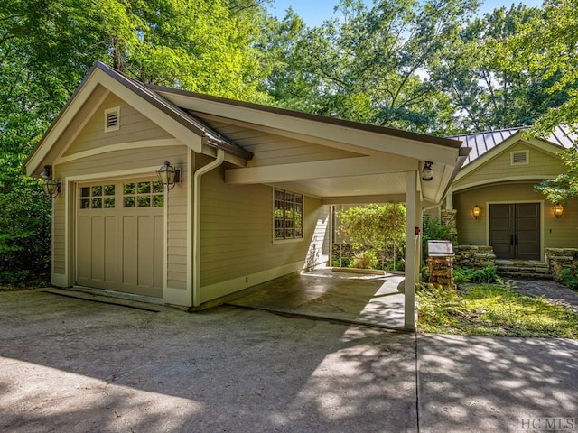 exterior space featuring a garage and a carport