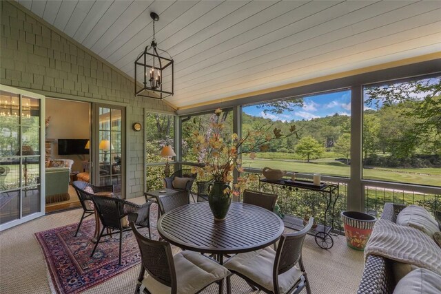 72 Winterberry Ct Unit 7, Highlands, NC 28741 - sunroom with lofted ceiling, carpet, a chandelier, and wooden ceiling