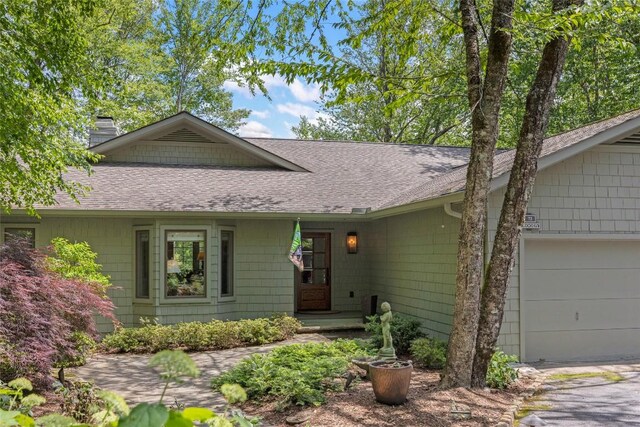 72 Winterberry Ct Unit 7, Highlands, NC 28741 - ranch-style home with a shingled roof, a chimney, and an attached garage