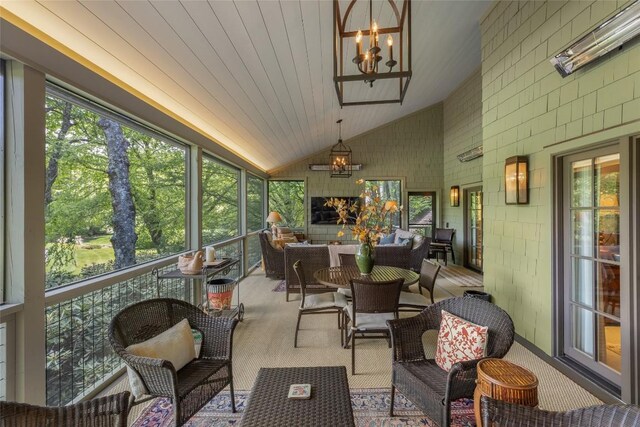 72 Winterberry Ct Unit 7, Highlands, NC 28741 - sunroom featuring a chandelier, lofted ceiling, an outdoor living space, and plenty of natural light