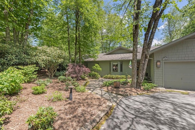 72 Winterberry Ct Unit 7, Highlands, NC 28741 - view of front of home with a garage and a shingled roof