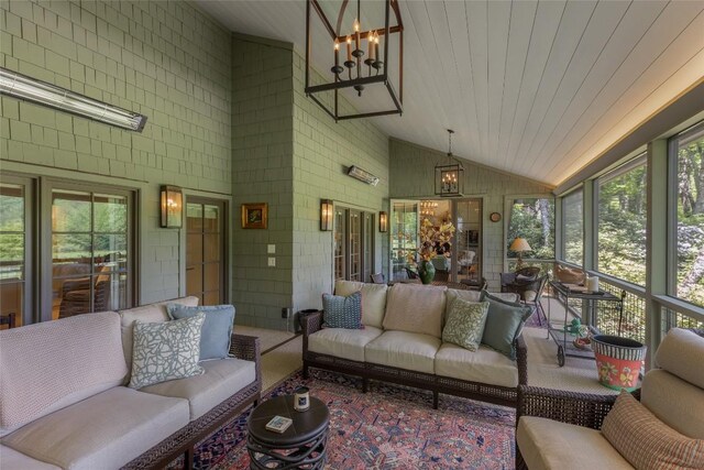 72 Winterberry Ct Unit 7, Highlands, NC 28741 - sunroom / solarium with lofted ceiling, healthy amount of natural light, an outdoor living space, and a chandelier