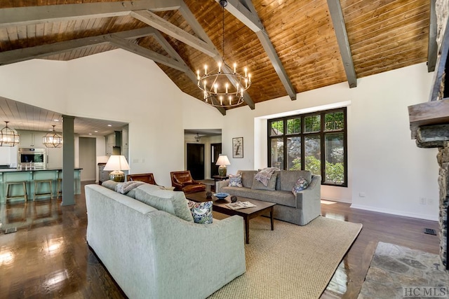 living room with dark hardwood / wood-style floors, a notable chandelier, and high vaulted ceiling