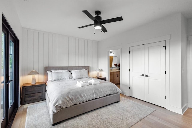 55 Steeplebush Ct, Tuckasegee, NC 28783 - bedroom with light wood finished floors, ensuite bath, ceiling fan, and a closet