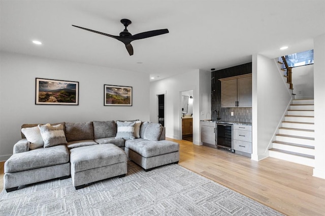 55 Steeplebush Ct, Tuckasegee, NC 28783 - living room featuring wine cooler, stairway, light wood-style floors, bar, and recessed lighting