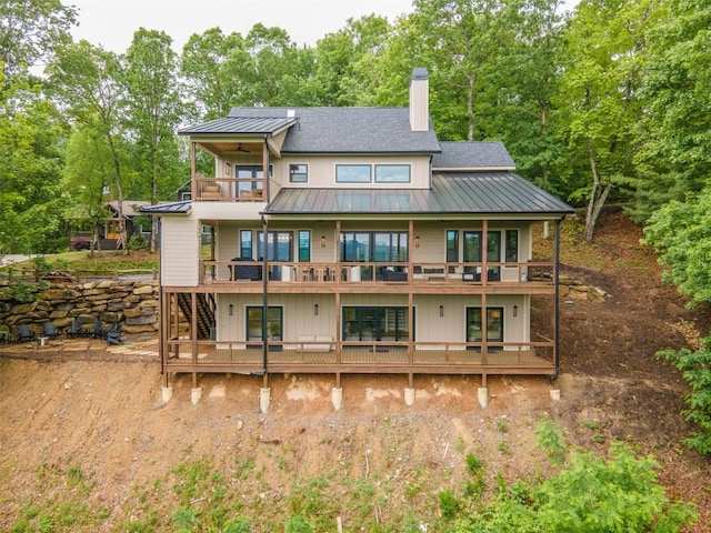 55 Steeplebush Ct, Tuckasegee, NC 28783 - rear view of house with a balcony, a standing seam roof, a chimney, ceiling fan, and a metal roof