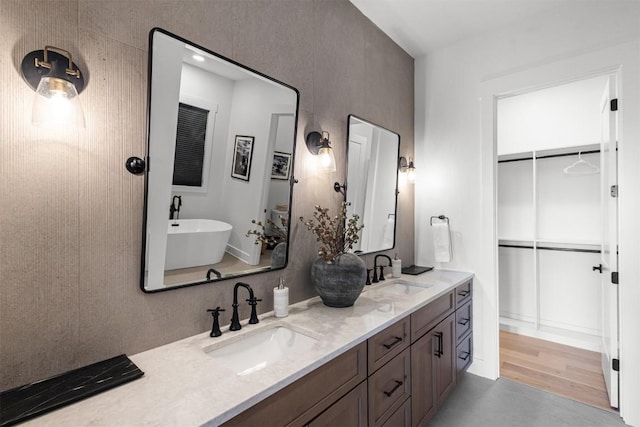 55 Steeplebush Ct, Tuckasegee, NC 28783 - bathroom with double vanity, a soaking tub, and a walk in closet