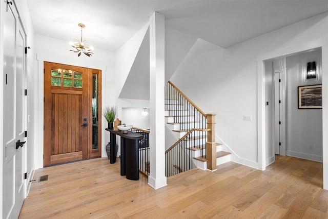 55 Steeplebush Ct, Tuckasegee, NC 28783 - foyer featuring light wood-type flooring, a chandelier, and stairway