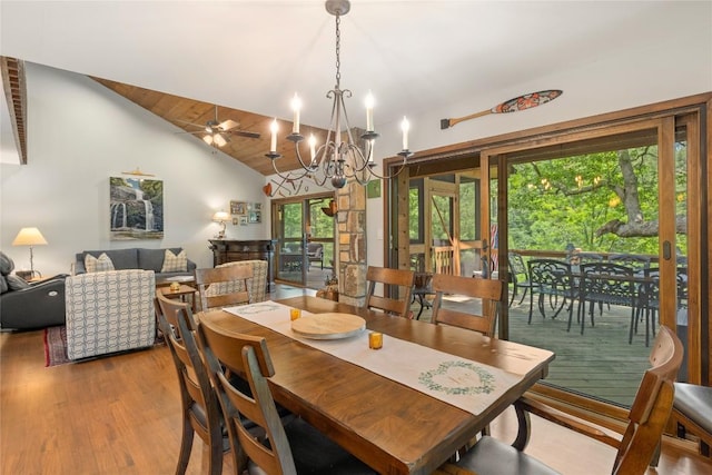 230 Jersey Trl Unit 12, Sapphire, NC 28774 - dining room featuring healthy amount of natural light, a chandelier, wood finished floors, high vaulted ceiling, and a ceiling fan