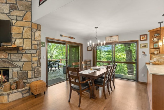 230 Jersey Trl Unit 12, Sapphire, NC 28774 - dining space featuring wood finished floors, plenty of natural light, and a chandelier