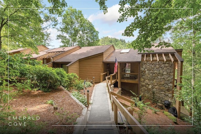 230 Jersey Trl Unit 12, Sapphire, NC 28774 - back of house with a shingled roof, stone siding, and stairs