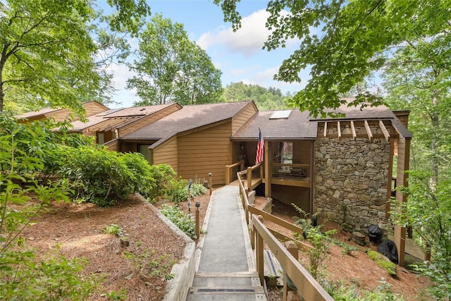 230 Jersey Trl Unit 12, Sapphire, NC 28774 - view of front of home with a shingled roof, stairway, and stone siding