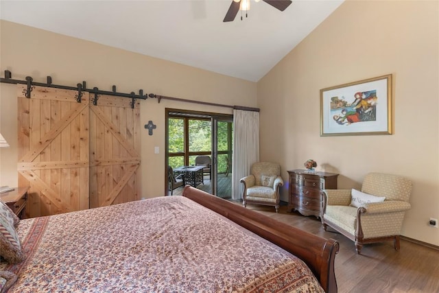 230 Jersey Trl Unit 12, Sapphire, NC 28774 - bedroom featuring wood finished floors, ceiling fan, a barn door, and high vaulted ceiling