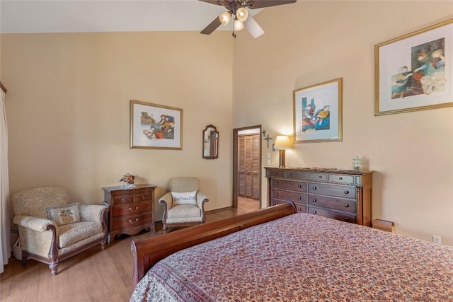 230 Jersey Trl Unit 12, Sapphire, NC 28774 - bedroom featuring light wood-type flooring, a towering ceiling, and a ceiling fan