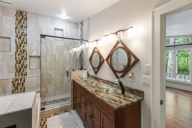 314 Beckonridge Trl, Sapphire, NC 28774 - bathroom featuring double vanity, a stall shower, and wood finished floors