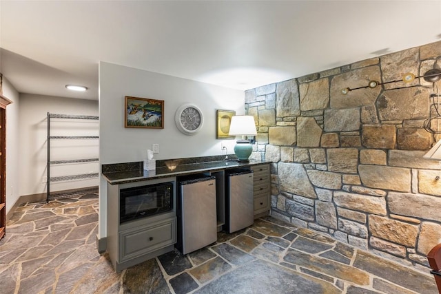 314 Beckonridge Trl, Sapphire, NC 28774 - kitchen with black microwave, stone floors, refrigerator, and dark stone counters
