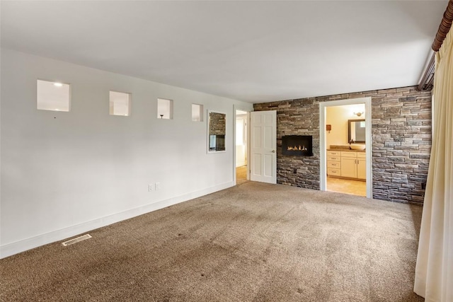 314 Beckonridge Trl, Sapphire, NC 28774 - unfurnished living room with carpet flooring and a fireplace