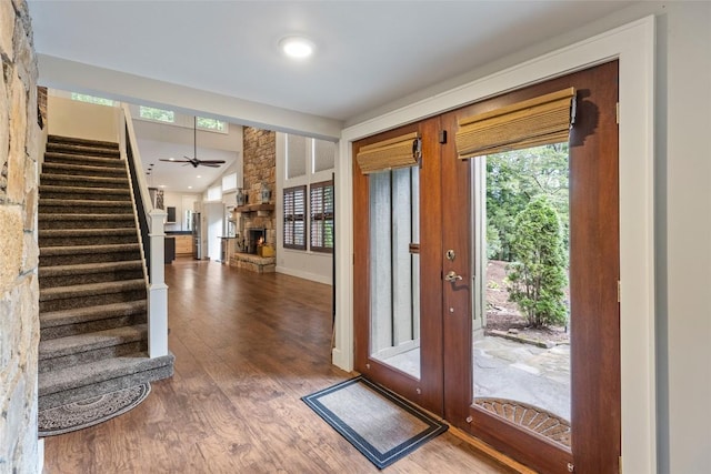 314 Beckonridge Trl, Sapphire, NC 28774 - entrance foyer with wood finished floors, stairs, a fireplace, ceiling fan, and recessed lighting