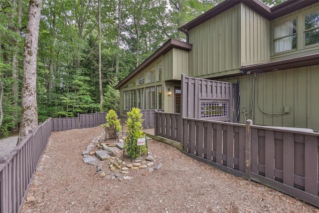 314 Beckonridge Trl, Sapphire, NC 28774 - view of property exterior featuring board and batten siding and a fenced backyard