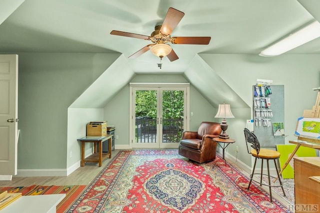 sitting room featuring vaulted ceiling, ceiling fan, and light hardwood / wood-style floors