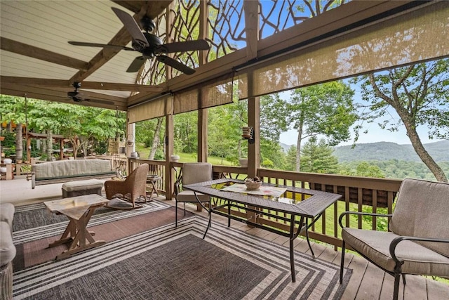 546 Upsy Daisy Ln, Cullowhee, NC 28723 - sunroom with ceiling fan, a mountain view, beamed ceiling, and plenty of natural light