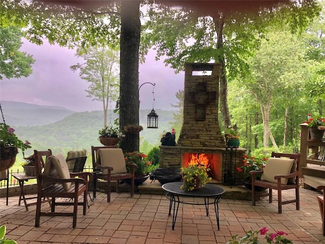 546 Upsy Daisy Ln, Cullowhee, NC 28723 - view of patio with an outdoor stone fireplace and a mountain view