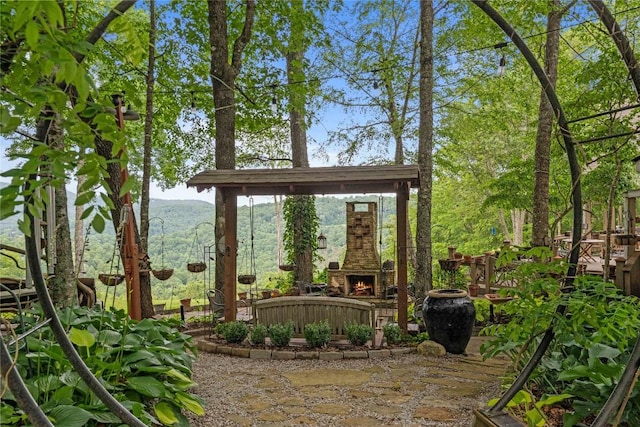 546 Upsy Daisy Ln, Cullowhee, NC 28723 - view of patio featuring an outdoor stone fireplace