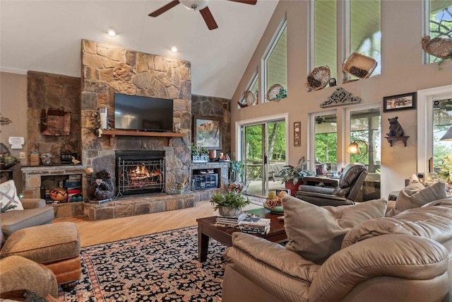 546 Upsy Daisy Ln, Cullowhee, NC 28723 - living room with a fireplace, a ceiling fan, plenty of natural light, wood finished floors, and a high ceiling