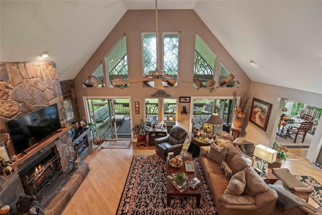 546 Upsy Daisy Ln, Cullowhee, NC 28723 - living area featuring a fireplace, high vaulted ceiling, wood finished floors, and a ceiling fan