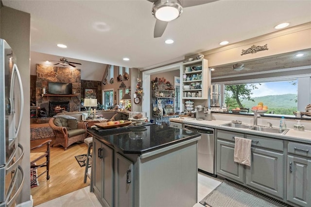 546 Upsy Daisy Ln, Cullowhee, NC 28723 - kitchen featuring stainless steel appliances, ceiling fan, gray cabinetry, a fireplace, and open floor plan