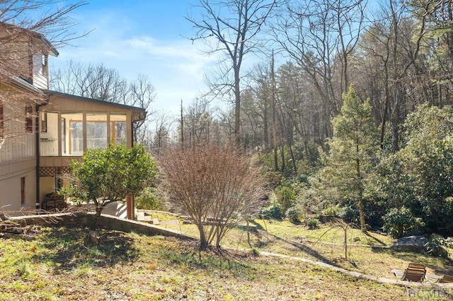 view of yard featuring a sunroom