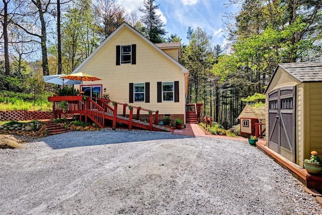 400 Cole Mountain Cir, Highlands, NC 28741 - back of property featuring stairs, a storage shed, a wooden deck, crawl space, and an outbuilding