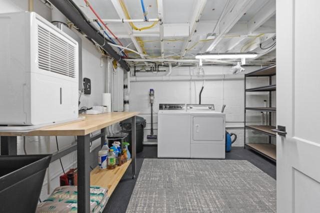 laundry room with washer and clothes dryer and laundry area