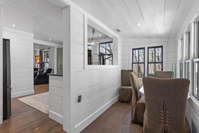 interior space featuring dark wood-style floors, baseboards, and visible vents