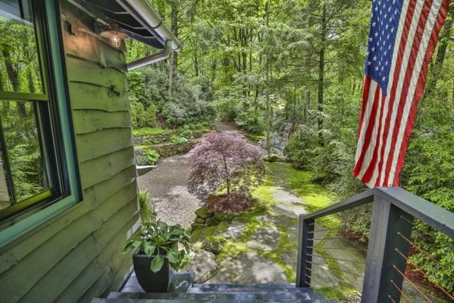 view of yard featuring a view of trees