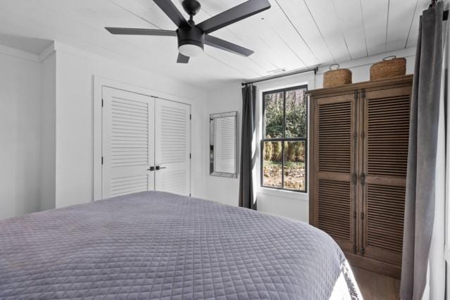 bedroom with ceiling fan and wood finished floors