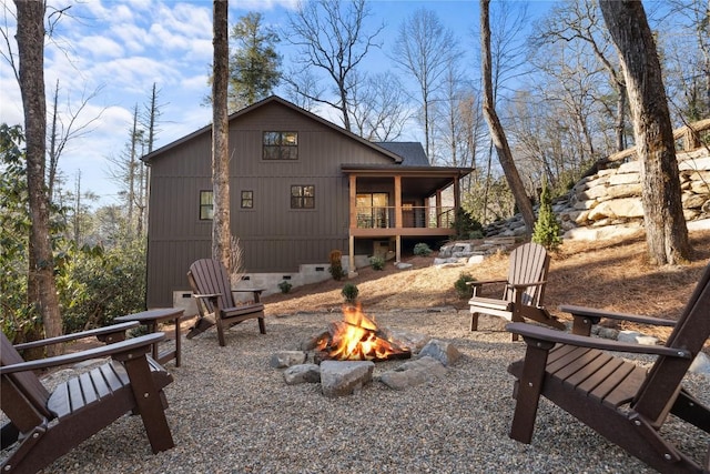 149 Woodland Hill Dr, Highlands, NC 28741 - back of house featuring an outdoor fire pit and crawl space