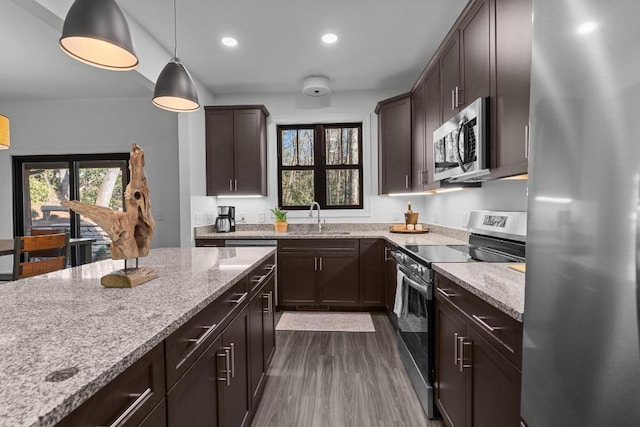 149 Woodland Hill Dr, Highlands, NC 28741 - kitchen featuring a sink, dark brown cabinetry, stainless steel appliances, and light stone counters
