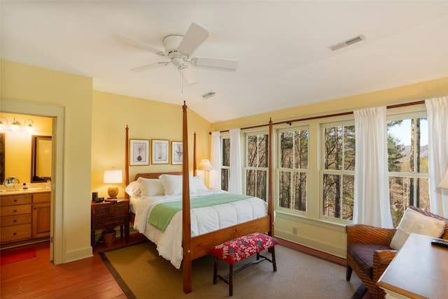 53 Rocky Top Dr, Cashiers, NC 28717 - bedroom with wood finished floors, vaulted ceiling, ceiling fan, and baseboards