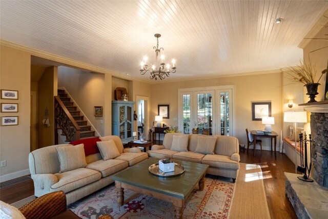 53 Rocky Top Dr, Cashiers, NC 28717 - living area featuring wood finished floors, a chandelier, a fireplace, crown molding, and stairway