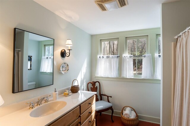 53 Rocky Top Dr, Cashiers, NC 28717 - full bath with healthy amount of natural light, baseboards, toilet, and vanity