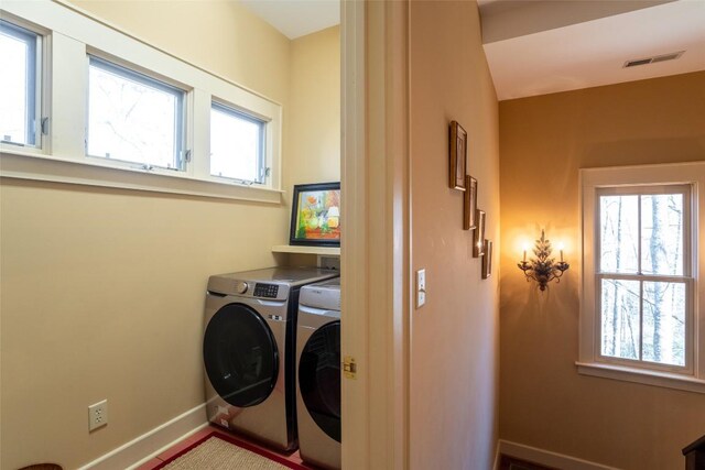 53 Rocky Top Dr, Cashiers, NC 28717 - laundry area with washing machine and clothes dryer and baseboards