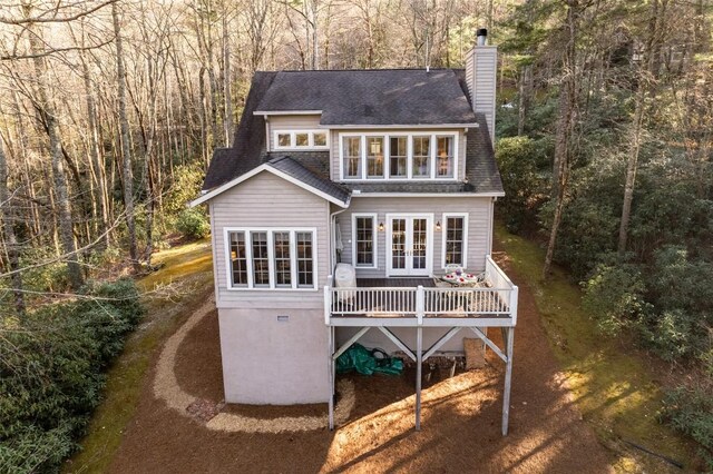 53 Rocky Top Dr, Cashiers, NC 28717 - rear view of house featuring french doors, a forest view, a chimney, a wooden deck, and driveway