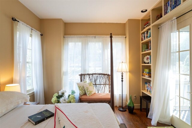 53 Rocky Top Dr, Cashiers, NC 28717 - bedroom with multiple windows and wood finished floors