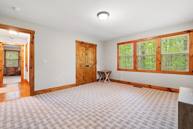 599 Tower Rd, Sapphire, NC 28774 - unfurnished bedroom with baseboards and carpet