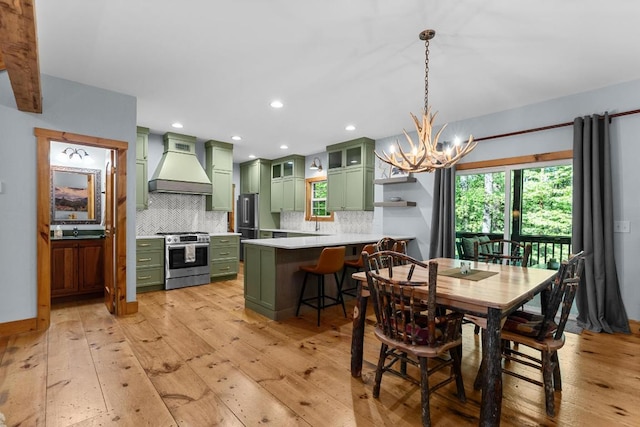 599 Tower Rd, Sapphire, NC 28774 - dining area with a chandelier, light wood finished floors, recessed lighting, and baseboards