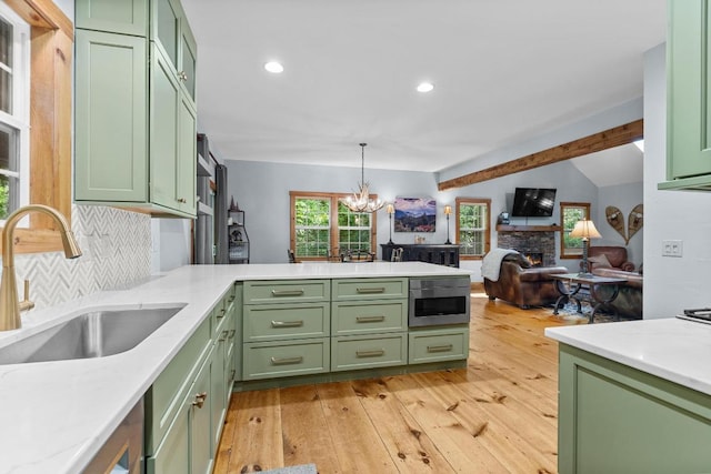 599 Tower Rd, Sapphire, NC 28774 - kitchen with green cabinetry, a sink, light countertops, a peninsula, and recessed lighting