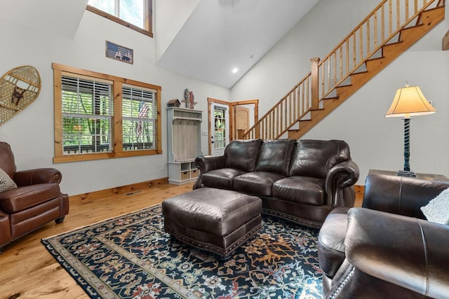 599 Tower Rd, Sapphire, NC 28774 - living area with stairs, wood finished floors, and high vaulted ceiling