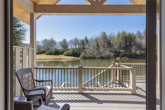 wooden deck featuring a water view